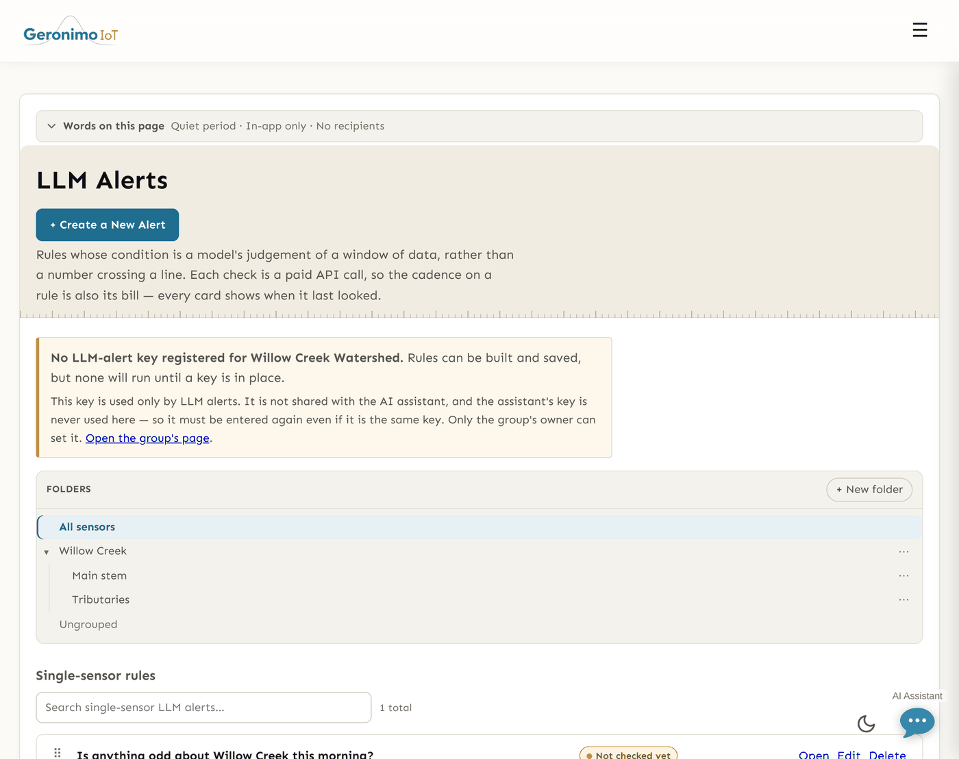 The LLM Alerts list. An amber panel reads "No LLM-alert key registered for Willow Creek Watershed. Rules can be built and saved, but none will run until a key is in place. This key is used only by LLM alerts. It is not shared with the AI assistant, and the assistant's key is never used here - so it must be entered again even if it is the same key. Only the group's owner can set it." Below the folder tree, a "Single-sensor rules" section holds one rule, "Is anything odd about Willow Creek this morning?", carrying an amber "Not checked yet" chip and Open, Edit and Delete links.